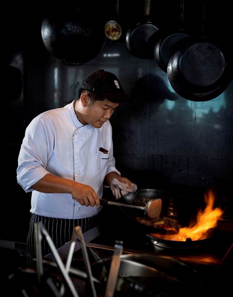 Cooking by wok is just one of the eight fire-based techniques at Sands.