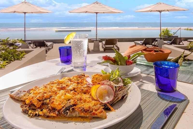 Guests at Azerai Ke Ga Bay can enjoy a meal with spectacular ocean views