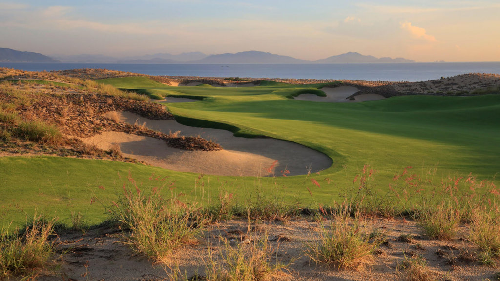 The 18th hole at KN Golf Links Cam Ranh offers stunning views of the ocean 
