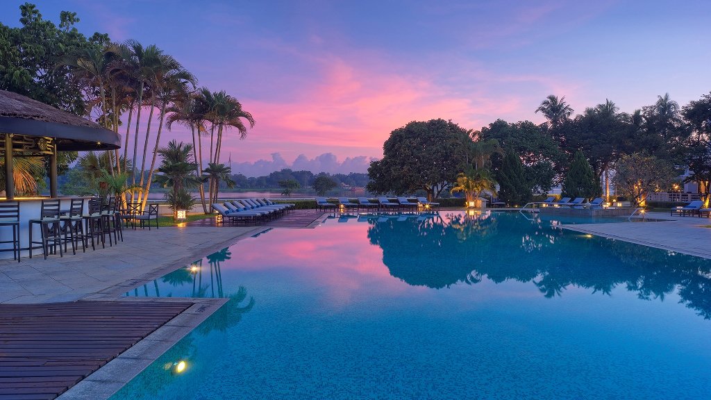 The Perfume River lies beyond the hotel’s salt water swimming pool