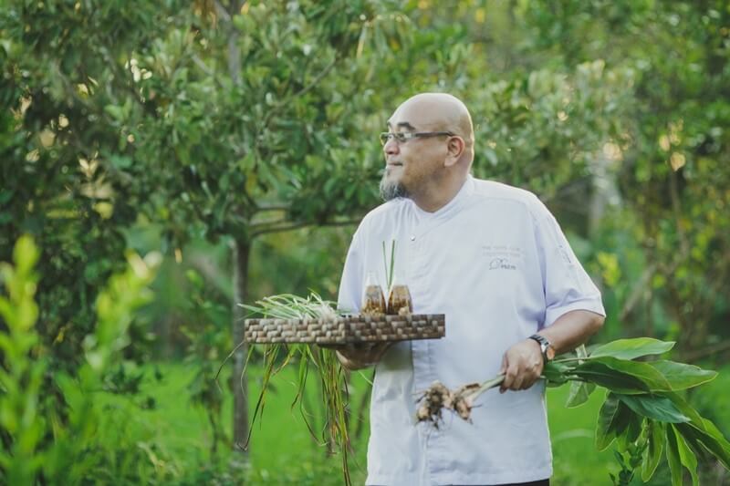Chef Dean carries fresh lemongrass, turmeric, ginger on a slow food journey.
