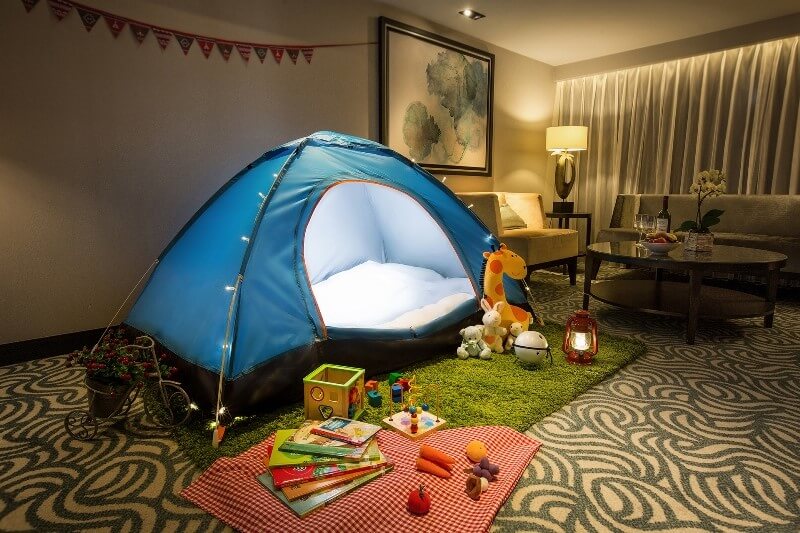 In-room camping experience in living area