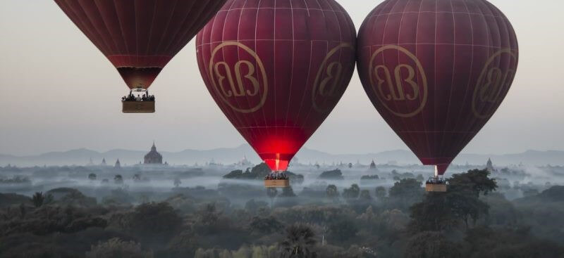 An iconic image of hot-air balloons over Bagan at dawn