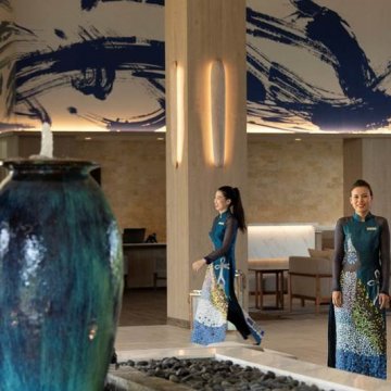 Meliá Ho Tram’s door women and waitresses don abstract interpretations of the iconic Vietnamese ao dai costume designed by Chula Fashion, turning many a holidaymaker’s head with captivating experiments in pattern and colour that also retain the feminine lines of the iconic garment.