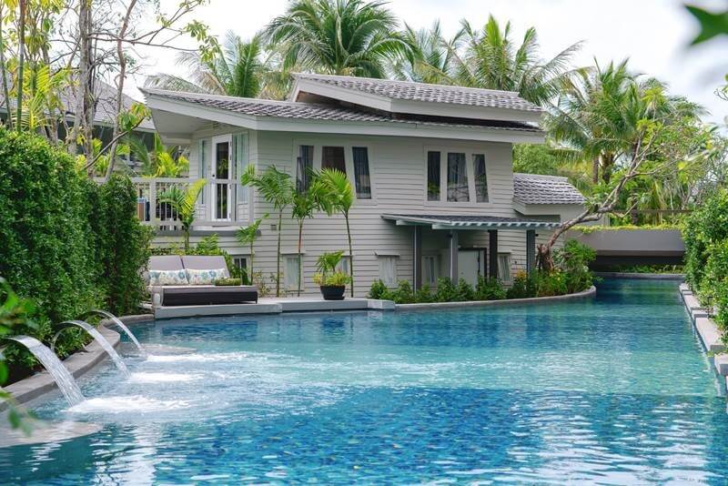 The resort is home to a lagoon pool that loops through its grounds like a river and two-story boat suites made from teak wood vessels that are more than 100 years old.