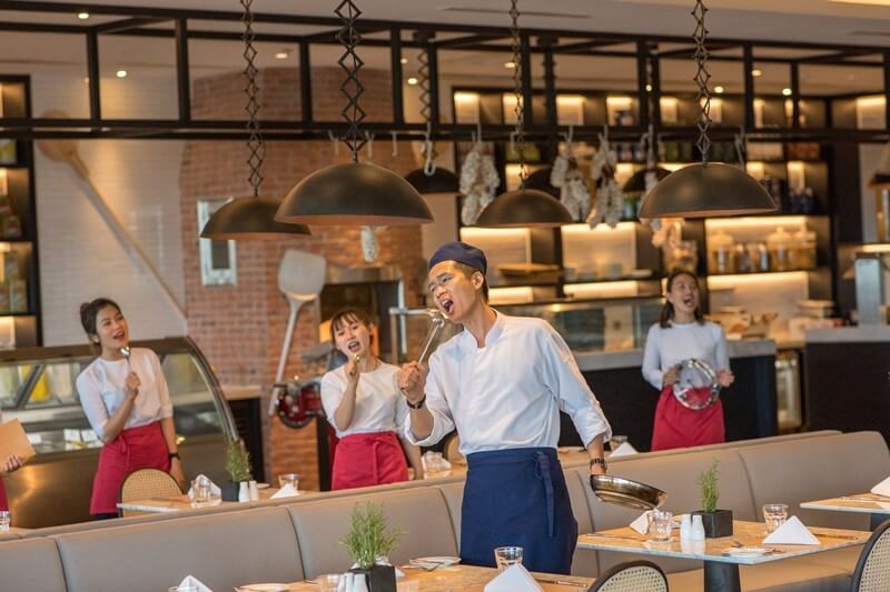 With ladles, pans and tambourines in hand, and with a live piano as a foundation, the apron-and-toque donning Alma Choir break into song and dance as suddenly as a flash mob to perform international and Vietnamese tunes at La Casa restaurant on Wednesday and Friday evenings.  