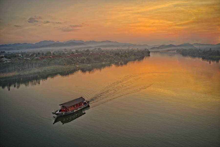 The sunset cruise plies the river at the golden hour