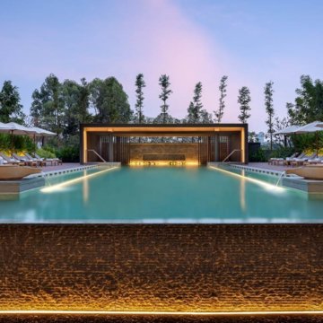 A 22-meter outdoor infinity pool surrounded by lush greenery is among the property’s leisure highlights.