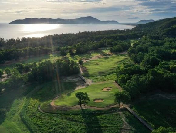 The course at Laguna Golf Lang Co is carved through emerald jungle near the azure East Sea