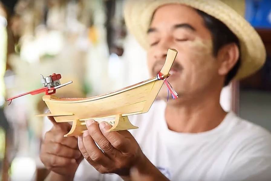 One of Ban Koh Klang's unique crafts is the making of model longtail boats, carved from locally sourced wood.