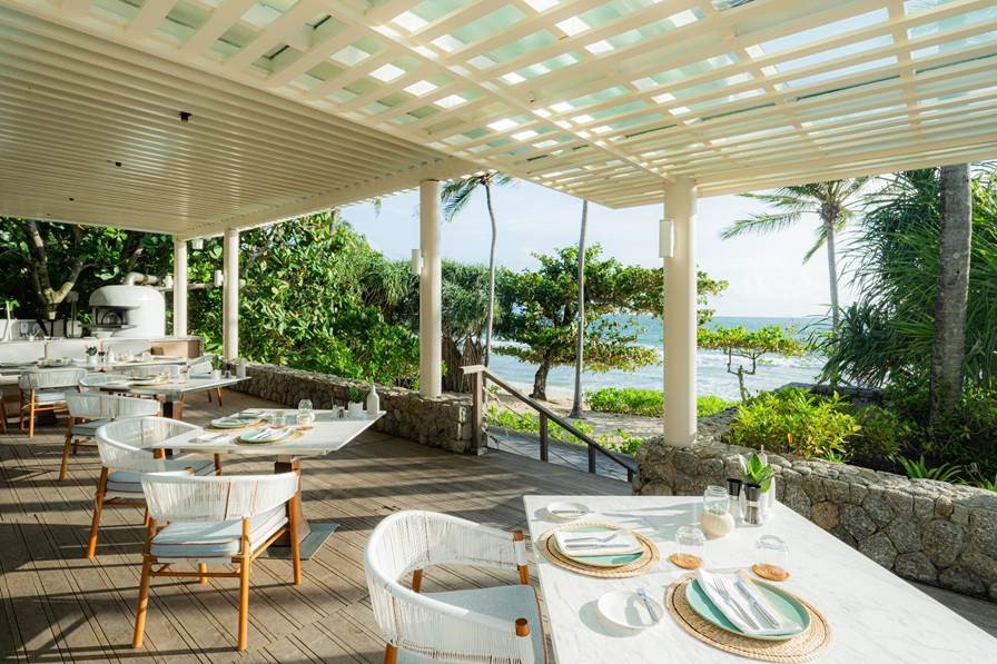 Waew’s outdoor seating is located mere metres from Trisara’s private beach