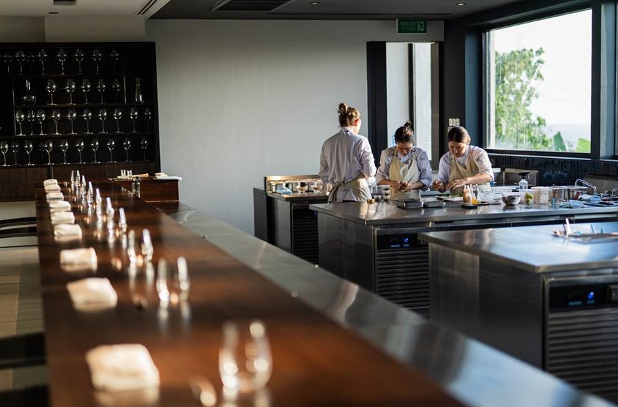A dining counter facing a theatre kitchen means guests can see how each morsel is prepared, thereby providing complete transparency to the culinary process