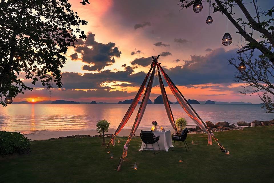 An open-air candlelit dinner awaits Valentine's diners at the Banyan Tree Krabi beachfront.