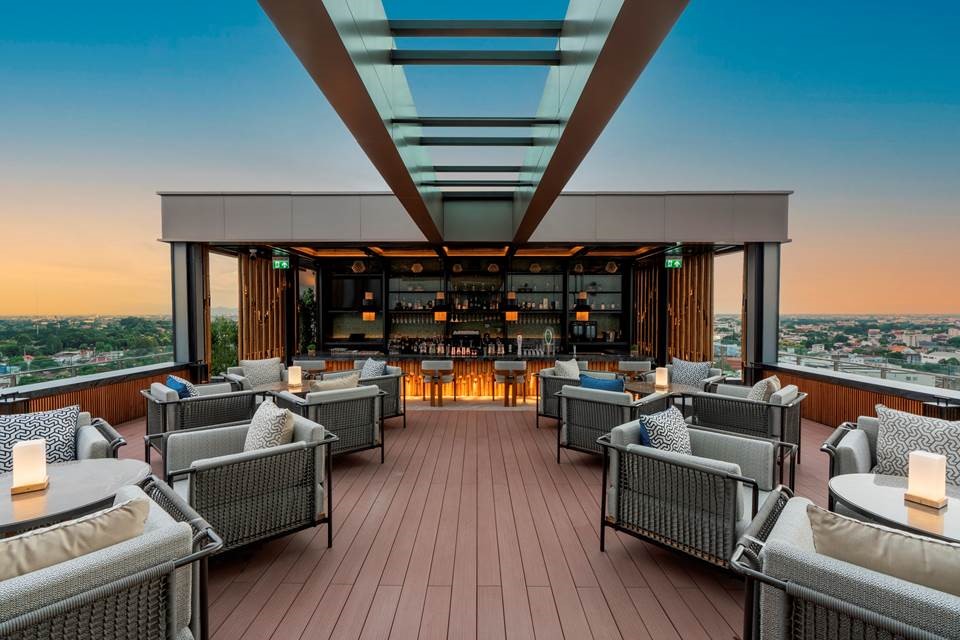 The remarkable venue features rooftop terraces at varying heights, with a spectacular glass bridge connecting the bar’s highest seating areas.