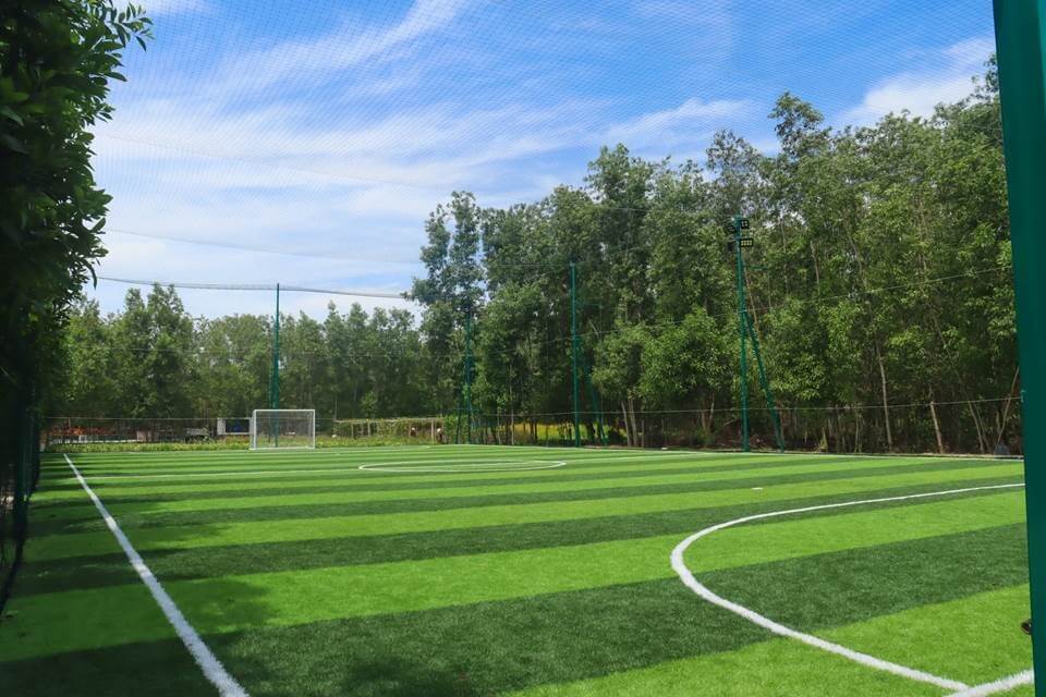 The new soccer field sports striped dark and light green grass and is already proving popular with football-obsessed Vietnamese and international guests.