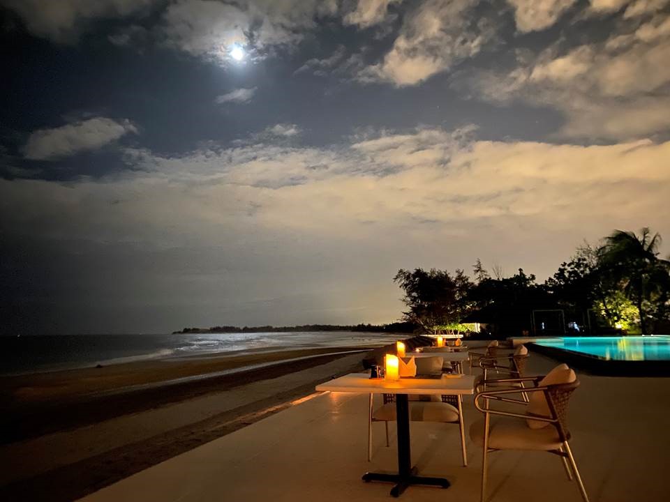 Softly lit tables overlook a pristine 5-kilometer stretch of white sand at Azerai Ke Ga Bay