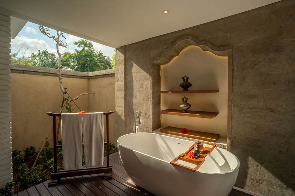 The villa features a spacious outdoor soaking tub