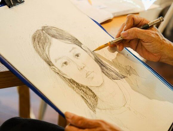 Talented Vietnamese Artist Sketches Guest Portraits at Alma Resort