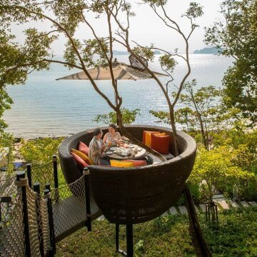 The Bird’s Nest tables sit precariously among the trees, perched high above the resort and overlooking the Andaman Sea