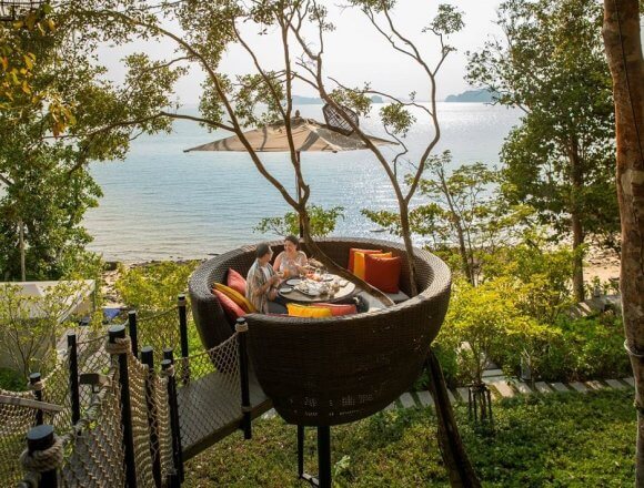 The Bird’s Nest tables sit precariously among the trees, perched high above the resort and overlooking the Andaman Sea