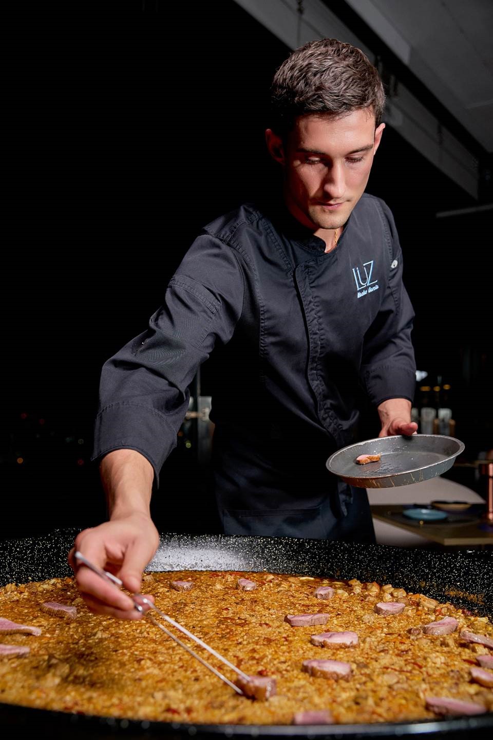 Spanish Chef de Cuisine, Madrid-born Juan Ignacio García Racionero, fires up his show-stopping giant pan of paella with rotating flavours.
